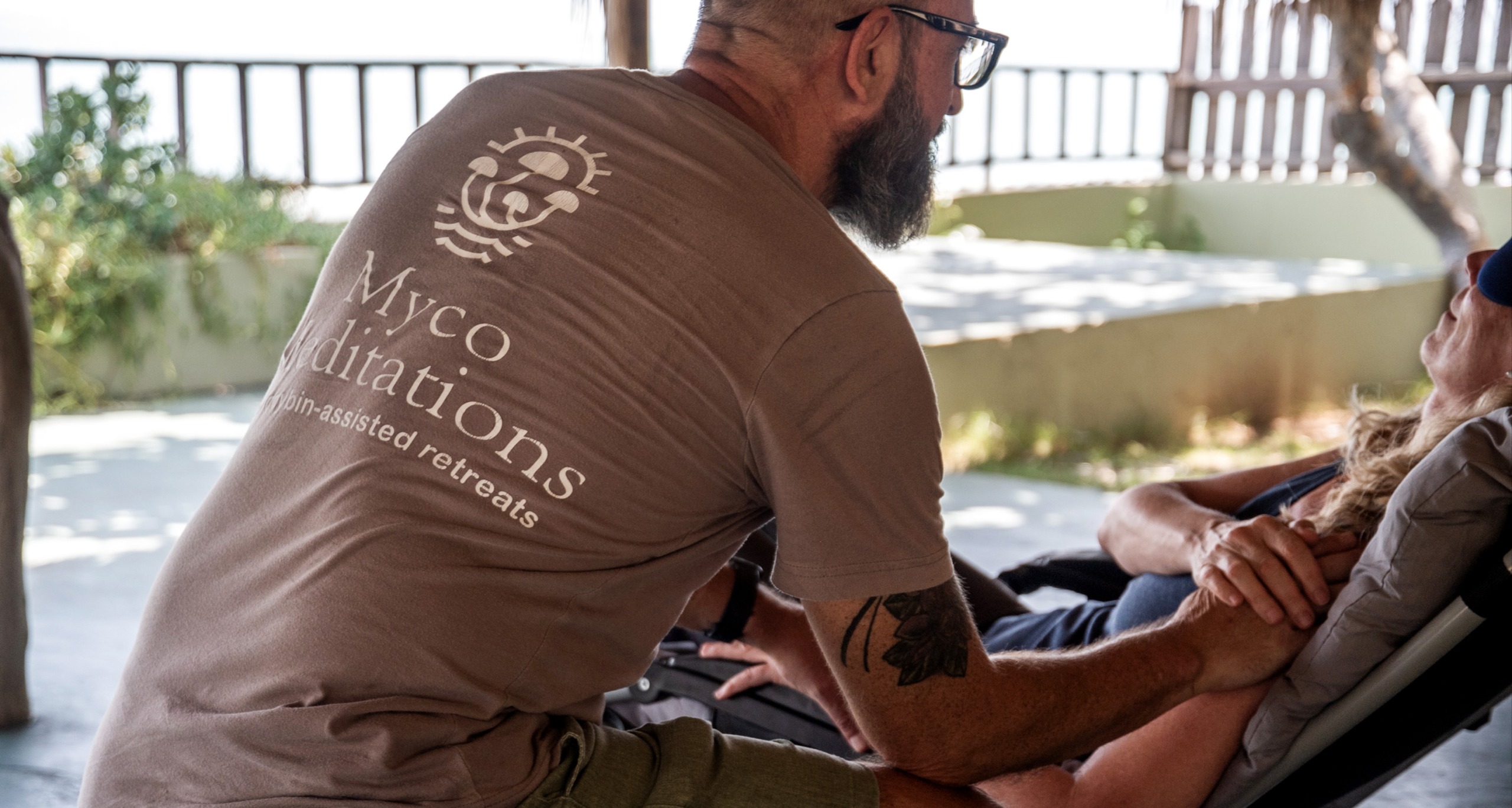 ceo and head facilitator of mycomeditations justin townsend guiding a client through a psilocybin therapy session