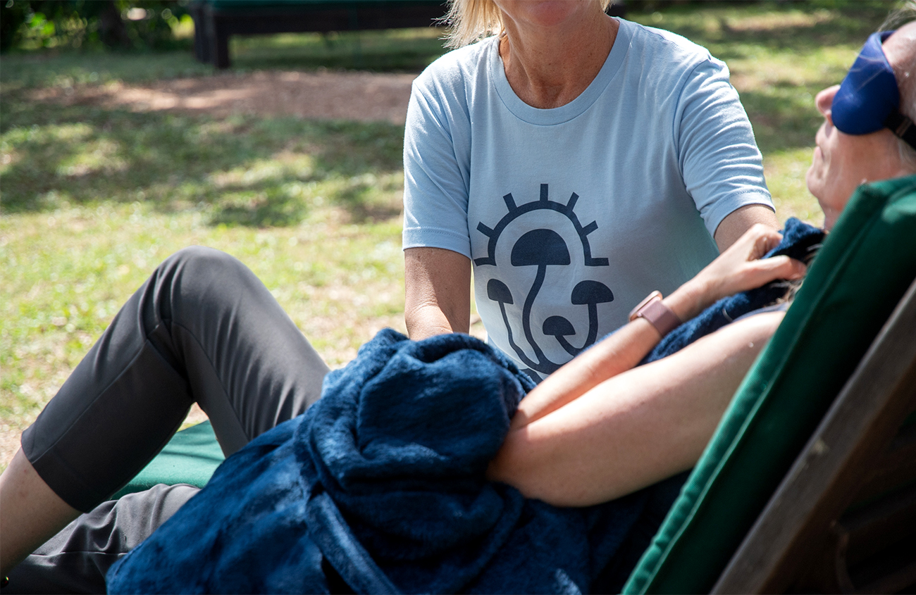 Psychedelic therapist guiding an outdoor psilocybin therapy session at MycoMeditations